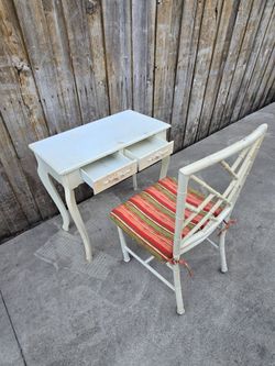 Small wood table and metal chair.
