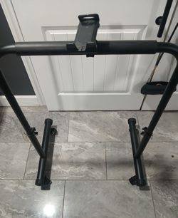 Treadmill with separate bar to hold on