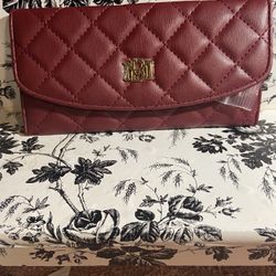 Authentic Brand New BADGLEY Mischka leather wallet in the color burgundy with gold hardware