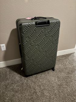 Green Juicy couture suit case 32"H x 21.5"W × 13" D