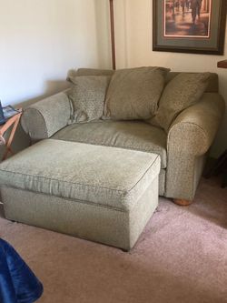 Oversized chair. Folds to twin bed w/ottoman storage