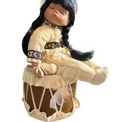 Doll  beautiful Native American porcelain doll, named Little Willie, is a wonderful addition to any doll collection. She stands 12 inches tall and fea