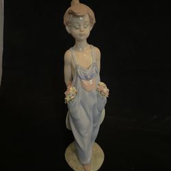 Lladro Porcelain Figurine of a Boy with Flowers