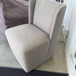 Light grey rolling dining chairs/captain chairs