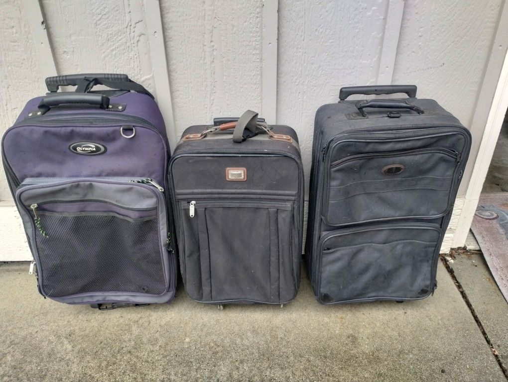 Three Medium Size Suitcases