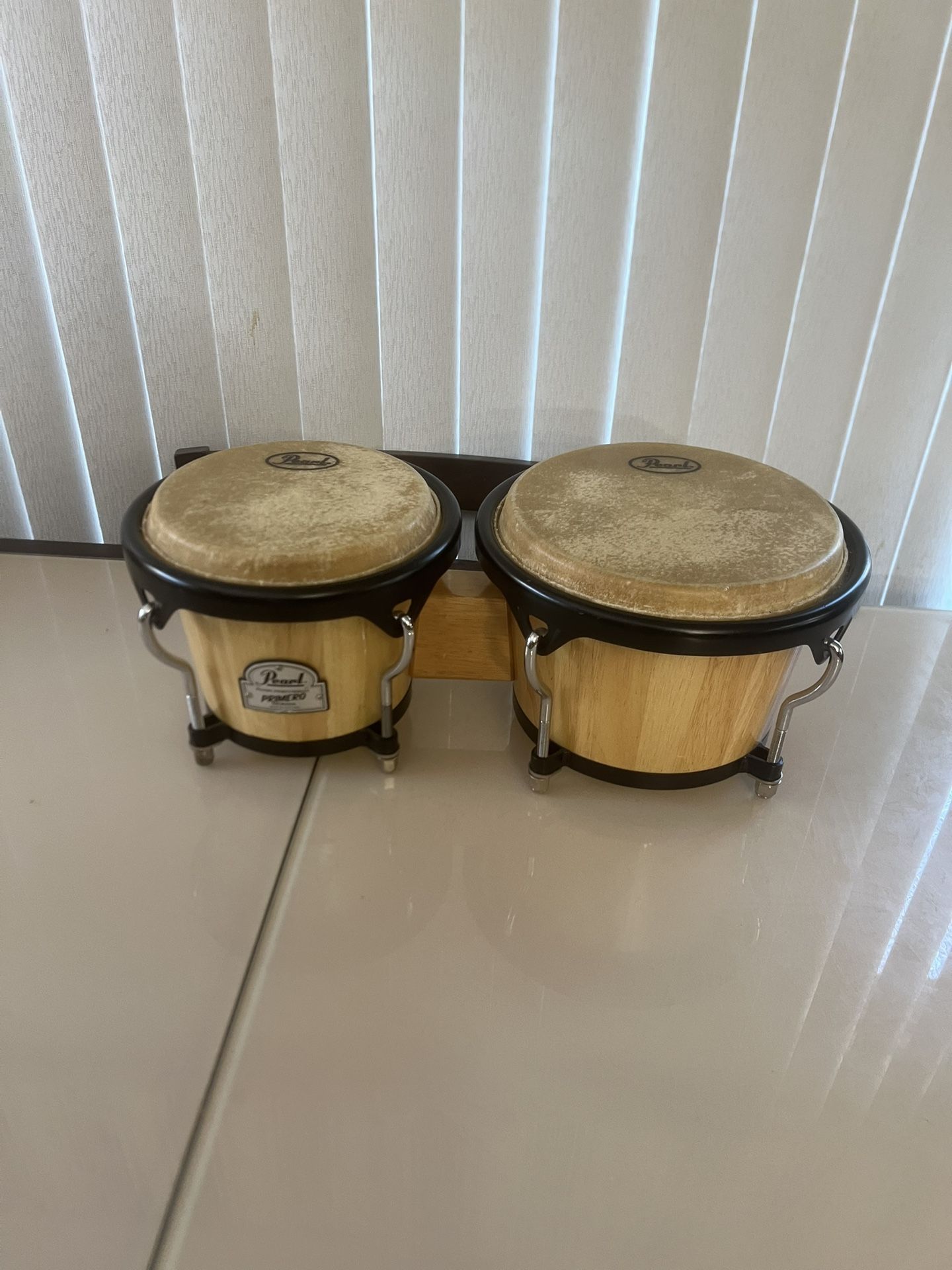 Pearl Percussion Primero Series Bongo Drums - Made in Thailand Hand Percussion. Used in good condition with some cosmetic blemishes. There blemishes a