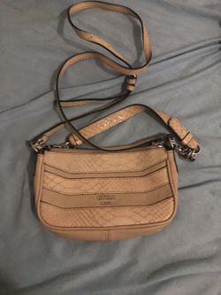 Tan Guess crossbody bag with adjustable strap.