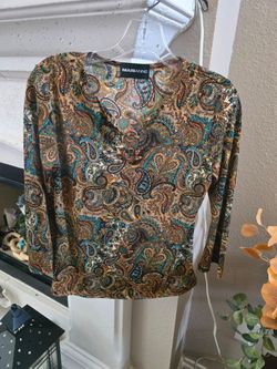vintage Marianne brand paisley top featuring a 3/4 or long sleeve cut, a split neckline detailed with metallic ring hardware, and an intricate bohemia