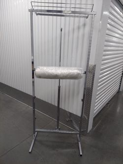 Plastic Garment Bags (as Pictured In Photos ) Have Two Brand New Rolls Of Garment Bags + I Roll Of Plastic (Not Bags)All Three For $95. Rack Is Sold.