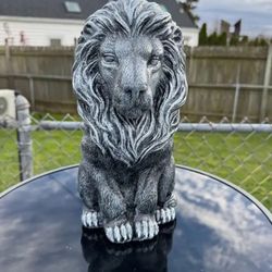The bookshelf, lion statue
