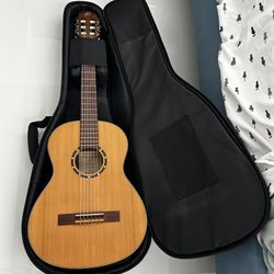 3/4 nylon string guitar with case