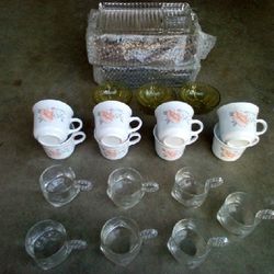 Eight glass serving trays, three glass trays, eight white coffee cups, seven clear coffee cups 