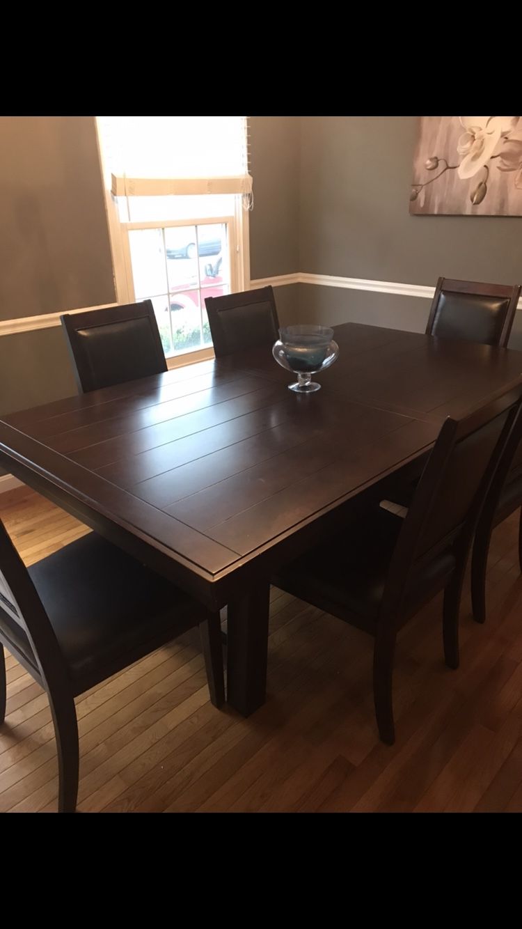 Barely used dining table and 6 chairs. Leaf included