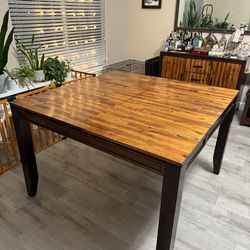 8-person extendable dining table and 8 chairs