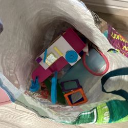 toy unicorns, small dolls, small cars, big car, flip a zoo, car set. 