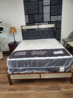 Black faux queen leather and mirror headboard with   solid metal bed frame (New)