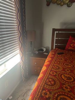 Queen bed with night stand and  lamp