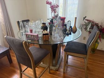 Round glass table and four chairs