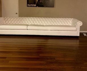 White leather sofa with built-in subwoofers