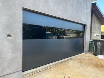 96” x 96 “ Modern Black Glass Garage Door – One Glass Panel