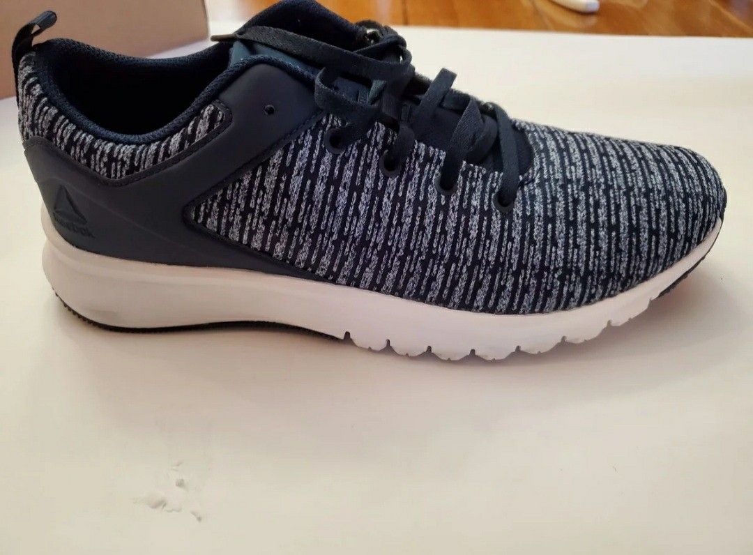 New Reebok Lux women's running shoe navy and white. Size 9.5 no box, looks a little dirty on bottom.