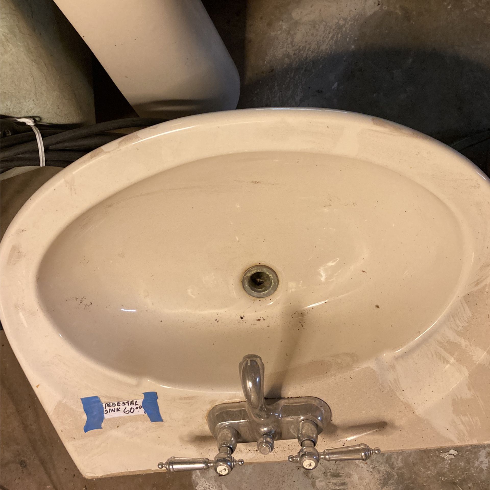 Like New American Standard Pedestal Sink With Delta Fixtures 