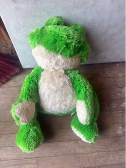 Celine Dion tour-branded frog plush toy with embroidered signature.