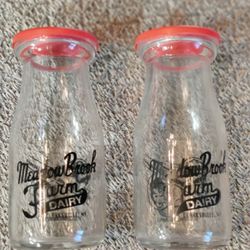 PAIR OF VINTAGE MILK BOTTLES