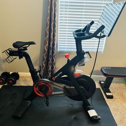 Peloton bike + mat in great condition! 