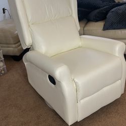 White recliner. Swivel