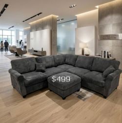 Dark gray corduroy sectional sofa with ottoman
