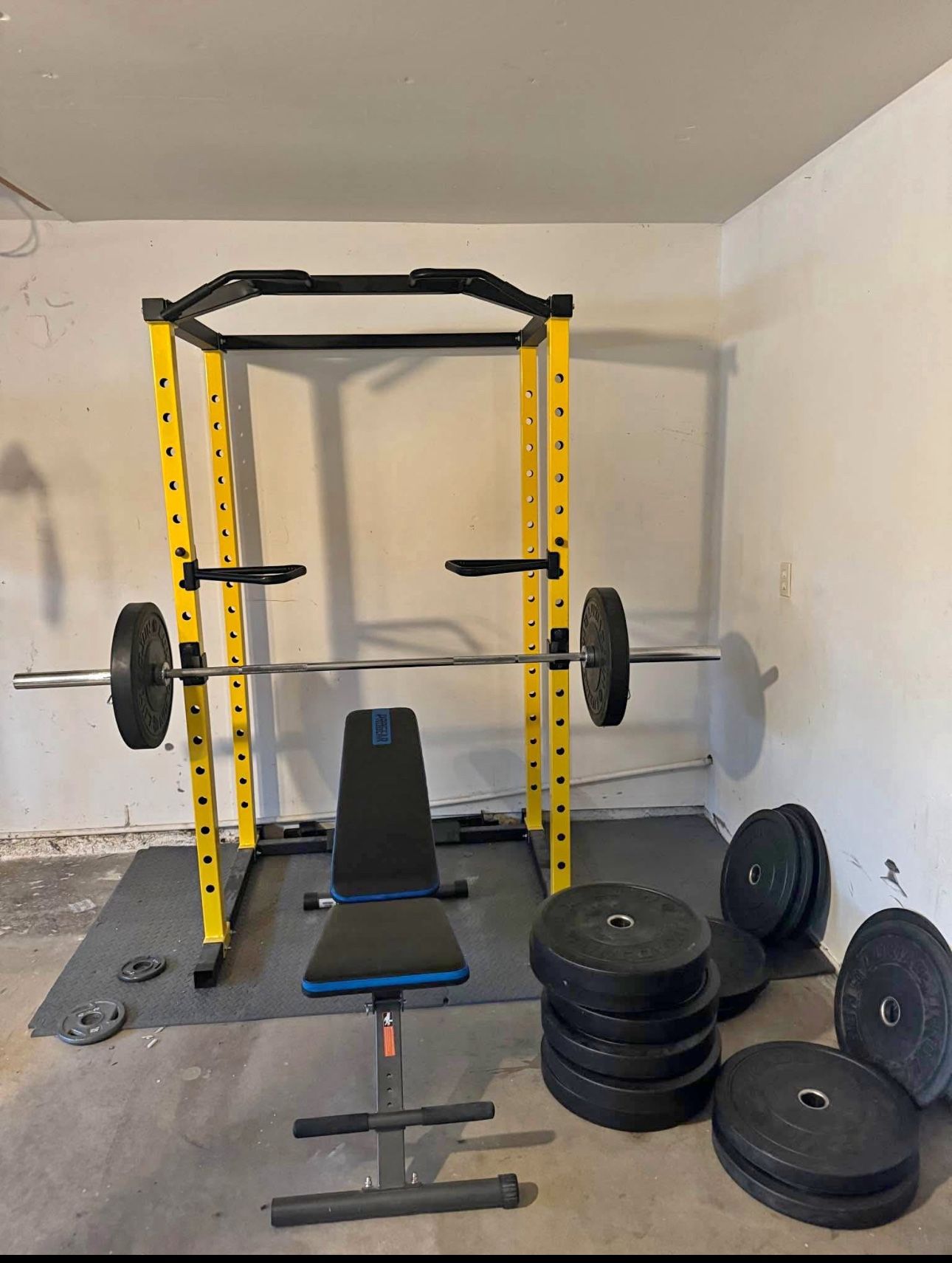 home gym items for sale squat rack/ barbell (45lb)/ 565lb bumper plates/ double cable machine (10-16