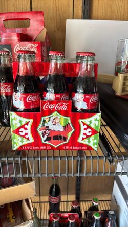 Coca Cola six pack 8 oz bottles.