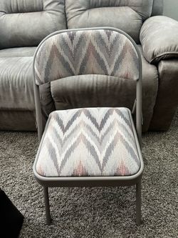 Set of two cloth padded folding chairs