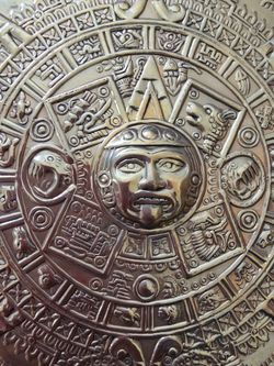 Brass round plate with carvings. Brask round plate with the carvings.