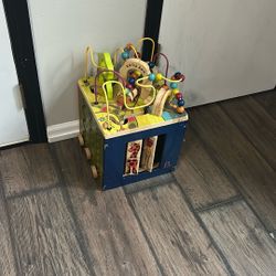 B. toys Zany Zoo Wooden Activity Cube. 