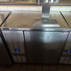 Perlick  Stainless steel beer dispenser with four taps. 