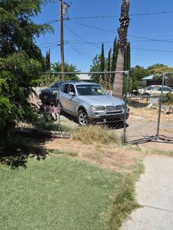08 BMW X 3 it's and silver blak int
