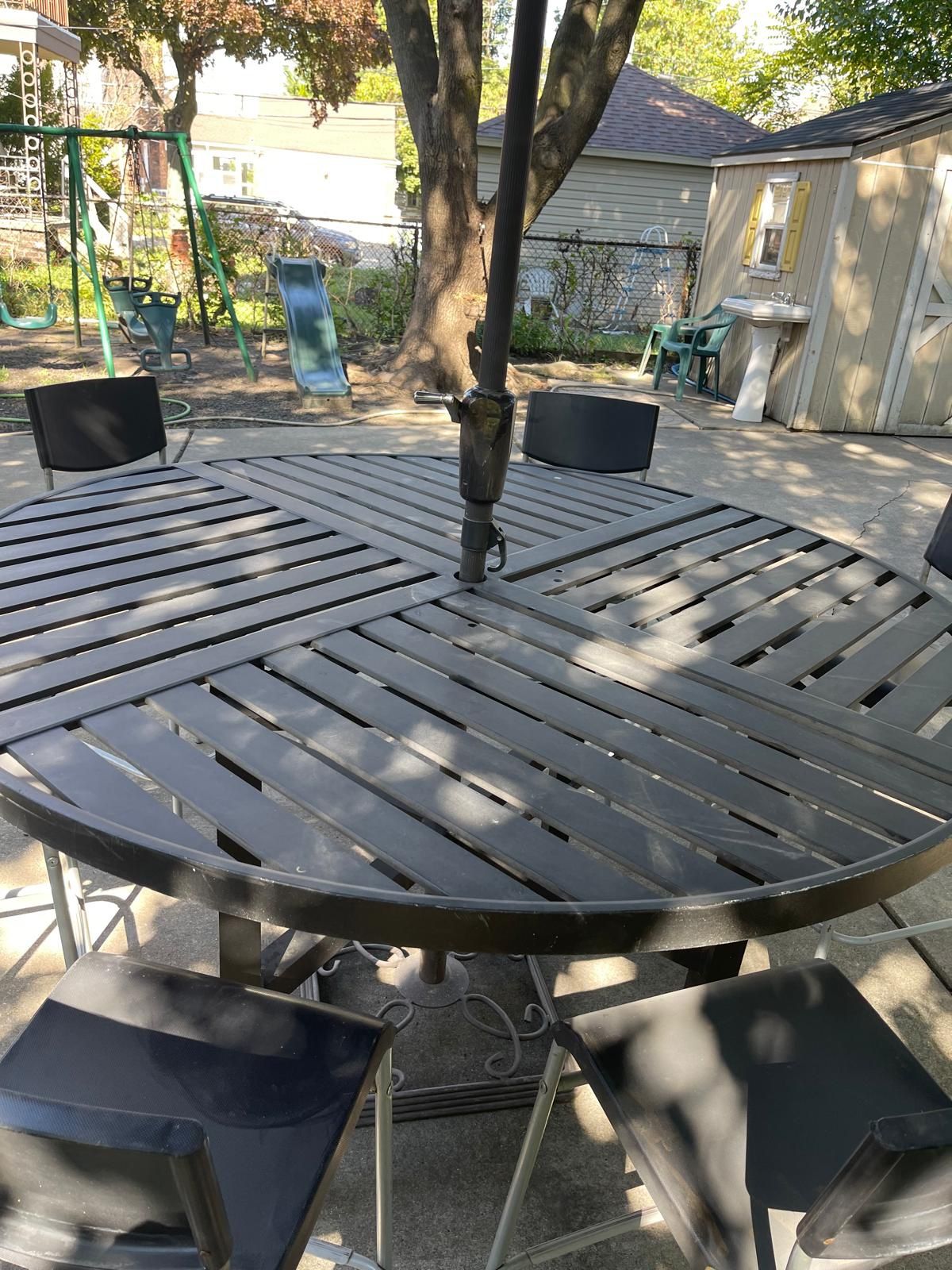 High Metal Round Table With Six Chairs And Umbrella