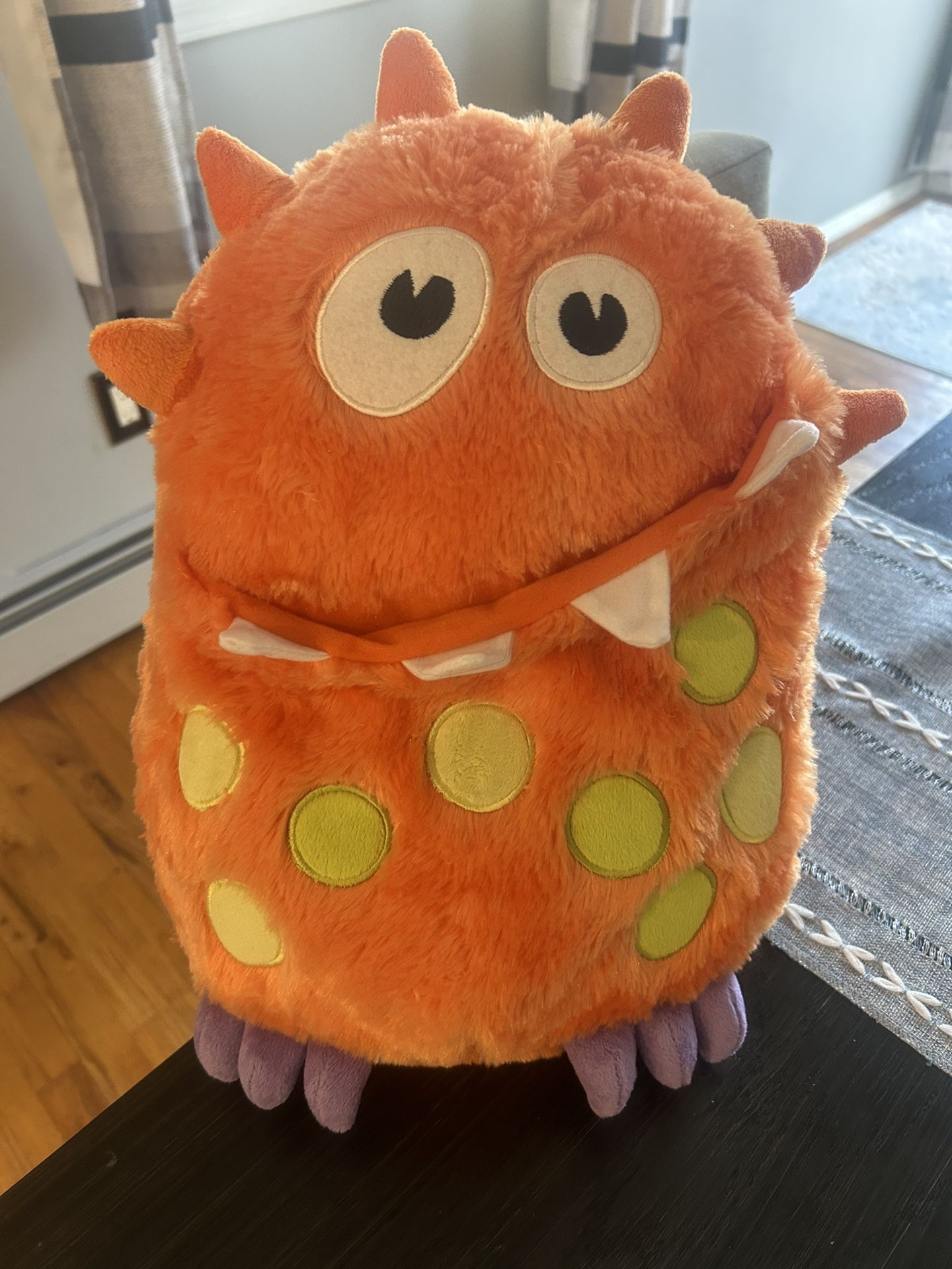 Orange and green monster plush toy