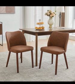 Four dining chairs new in the box