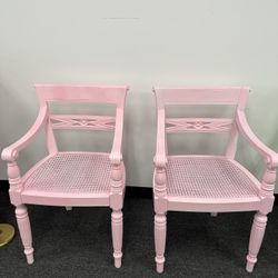 Two pink statement chairs 