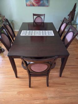 Dining room table with 6 chairs.