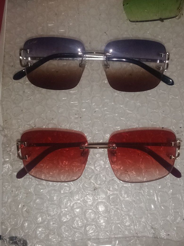 2 Pair Of Big C Cartier Glasses 