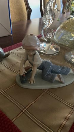 Lladro. Boy with train. All a board