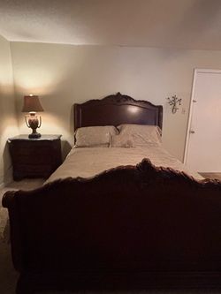 Dark Wood Sleigh Bed Frame with Carved Detail