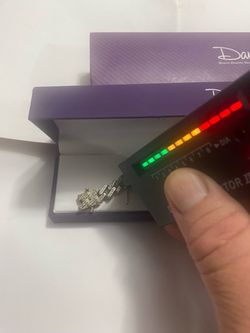 Selling a silver slave bracelet with 140 diamonds, measuring 9” in length, I paid 725, I’m only asking for 380, the price is firm.