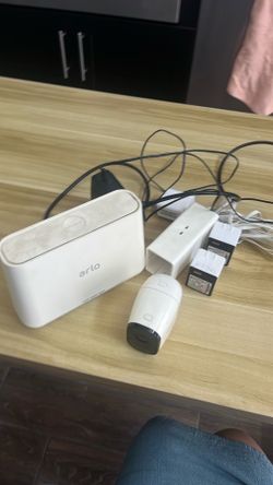 Arlo camera with batteries and chargers