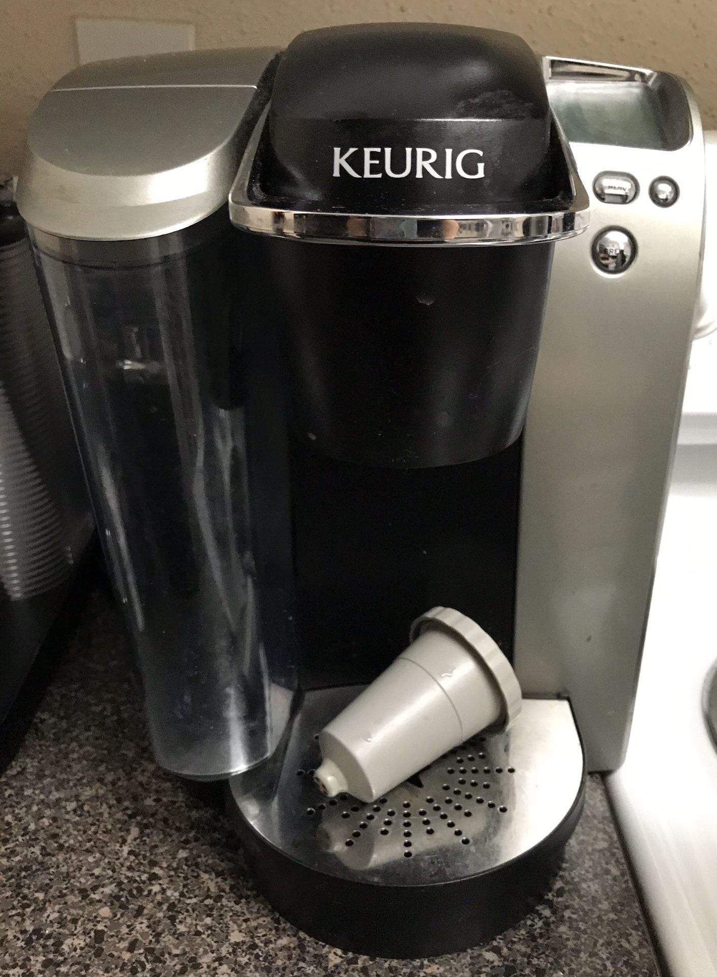 Keurig coffee maker, pod holder and Peet’s coffee and a variety of other pods