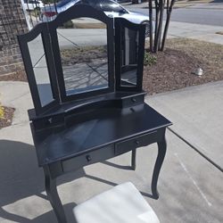 makeup vanity table with a stool. 